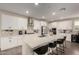 Bright kitchen featuring a large island, white cabinetry, and stainless steel appliances at 5281 S Red Rock St, Gilbert, AZ 85298