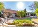 An inviting backyard featuring lush greenery, patio, and a serene outdoor space at 5802 E Fountain St, Mesa, AZ 85205