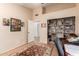 Bedroom with a comfortable sitting area, built-in shelving, and a neutral color palette, creating a serene and inviting space at 5802 E Fountain St, Mesa, AZ 85205