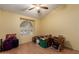 Versatile bedroom with natural light, a ceiling fan, and ample space for storage, offering potential for customization at 5802 E Fountain St, Mesa, AZ 85205