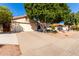 A one-story home with a two-car garage and low maintenance landscaping at 5802 E Fountain St, Mesa, AZ 85205