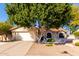 Charming single-story home featuring a well-maintained yard and a two-car garage at 5802 E Fountain St, Mesa, AZ 85205