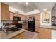 Well-lit kitchen with light cabinets and appliances and an open design at 5802 E Fountain St, Mesa, AZ 85205