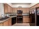 Well-organized kitchen with modern black appliances and ample cabinet space at 5802 E Fountain St, Mesa, AZ 85205