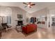 Spacious living room featuring high ceilings, a fireplace, and hardwood floors at 5802 E Fountain St, Mesa, AZ 85205