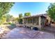 Enclosed patio area features concrete flooring and screening at 5802 E Fountain St, Mesa, AZ 85205