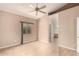 Bedroom featuring a ceiling fan, carpet, and a view into the bathroom at 653 S Catalina St, Gilbert, AZ 85233