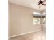 Bedroom with neutral colored walls, tile floor and several windows at 653 S Catalina St, Gilbert, AZ 85233