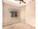 Bright bedroom featuring neutral walls, tiled floors, and a window with a patterned valance at 653 S Catalina St, Gilbert, AZ 85233