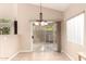 Dining area bathed in natural light, featuring a sliding glass door to outdoor space and tile flooring at 653 S Catalina St, Gilbert, AZ 85233