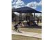 Community playground equipment with shade structure provides recreation and Gathering fun at 653 S Catalina St, Gilbert, AZ 85233