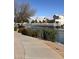 Picturesque pond with a pedestrian bridge and mature landscaping at 653 S Catalina St, Gilbert, AZ 85233