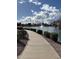 Walkway along the pond with lush landscaping and neighborhood views at 653 S Catalina St, Gilbert, AZ 85233