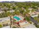 Aerial view showing the community pool and surrounding residential area with mountain views at 6542 N 7Th Ave # 30, Phoenix, AZ 85013