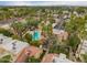 Overhead view of a community with a pool, showcasing lush greenery and well-kept residential buildings at 6542 N 7Th Ave # 30, Phoenix, AZ 85013