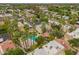 Aerial view featuring a community pool surrounded by lush landscaping and well-maintained residential buildings at 6542 N 7Th Ave # 30, Phoenix, AZ 85013