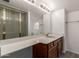Bathroom featuring an extended countertop, updated vanity, and sliding glass doors to shower at 6542 N 7Th Ave # 30, Phoenix, AZ 85013