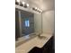 Bathroom features a large vanity with a mirror and modern lighting at 6542 N 7Th Ave # 30, Phoenix, AZ 85013