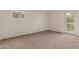 Neutral bedroom features natural light and walk out door to patio at 6542 N 7Th Ave # 30, Phoenix, AZ 85013