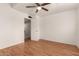 This bedroom has sleek wood floors and a ceiling fan providing both comfort and style at 6542 N 7Th Ave # 30, Phoenix, AZ 85013