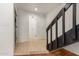 Foyer features tile flooring, staircase, and open view to living area and hallway at 6542 N 7Th Ave # 30, Phoenix, AZ 85013