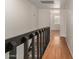 Open hallway with wood floors and view to bedroom with bright natural light at 6542 N 7Th Ave # 30, Phoenix, AZ 85013