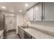 Modern kitchen features stainless steel appliances, gray cabinetry, and gray countertops at 6542 N 7Th Ave # 30, Phoenix, AZ 85013