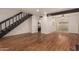 Bright open living area boasts hardwood floors, stairs, and sliding glass doors at 6542 N 7Th Ave # 30, Phoenix, AZ 85013