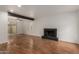 Spacious living area featuring hardwood floors and a cozy fireplace at 6542 N 7Th Ave # 30, Phoenix, AZ 85013