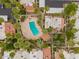 Aerial view of a beautiful community pool surrounded by lush palm trees and well-maintained landscaping at 6542 N 7Th Ave # 30, Phoenix, AZ 85013