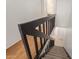 Staircase features black railing with view to tiled foyer at bottom of stairs at 6542 N 7Th Ave # 30, Phoenix, AZ 85013