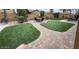 The backyard features a manicured lawn and a seating area for entertaining friends and Gathering at 6881 W Greenbriar Dr, Glendale, AZ 85308