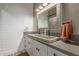 This bathroom features a concrete sink, stylish fixtures and a modern, rustic aesthetic at 6881 W Greenbriar Dr, Glendale, AZ 85308