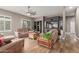 Inviting living room with built-in shelving, ceiling fan, and comfortable seating at 6881 W Greenbriar Dr, Glendale, AZ 85308