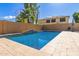 The backyard features a large pool with tiled deck area and a water feature at 6881 W Greenbriar Dr, Glendale, AZ 85308