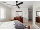 Cozy bedroom featuring a ceiling fan, neutral color scheme, and comfortable furnishings at 710 S Beck Ave, Tempe, AZ 85281