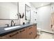 Elegant bathroom with double vanities, modern fixtures, and a glass-enclosed shower at 9246 N 108Th St, Scottsdale, AZ 85259