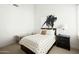 Bright bedroom with a polka dot duvet, neutral carpet, and a modern art piece at 9246 N 108Th St, Scottsdale, AZ 85259