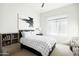 Bedroom with a bed, graphic artwork, ample natural light from a window, and neutral colors at 9246 N 108Th St, Scottsdale, AZ 85259