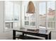 Bright dining area featuring windows with white shutters, modern lighting, and a dark wood table at 9246 N 108Th St, Scottsdale, AZ 85259