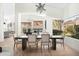 Dining room featuring hardwood floors, modern decor, and an oversized window at 9246 N 108Th St, Scottsdale, AZ 85259