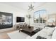 Living room featuring hardwood floors, modern decor, and an oversized window at 9246 N 108Th St, Scottsdale, AZ 85259