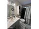 Updated bathroom featuring modern vanity, decorative mirror, and stylish tile flooring at 9302 E Broadway Rd # 64, Mesa, AZ 85208
