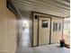 Attached carport leading to a back door, small windows and an open backyard at 9302 E Broadway Rd # 64, Mesa, AZ 85208