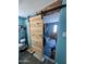 Walk-in closet with custom wooden door and ample storage space at 9302 E Broadway Rd # 64, Mesa, AZ 85208