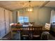 Dining room with seating for six, storage cabinets and natural light at 9302 E Broadway Rd # 64, Mesa, AZ 85208