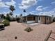 Charming single-story home with desert landscaping, covered porch, and ample outdoor space at 9302 E Broadway Rd # 64, Mesa, AZ 85208
