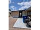 Exterior view of home with a covered walkway and outdoor storage or utility area at 9302 E Broadway Rd # 64, Mesa, AZ 85208
