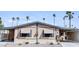 Charming single-story home featuring awnings, low maintenance landscaping, and a covered carport in a desirable location at 9302 E Broadway Rd # 64, Mesa, AZ 85208