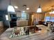 Close up of the kitchen island with stainless steel sink and a view of the rest of the room at 9302 E Broadway Rd # 64, Mesa, AZ 85208